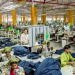 Garment workers producing clothing in an apparel manufacturing factory